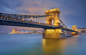 View of Chain Bridge and Budapest illuminated at twilight in Hungary
