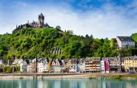 Imperial Castle on mountain with houses overlooking Mosel river in Cochem, Germany