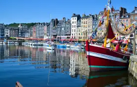 Old Harbour of Honfleur, France, featuring colourful fishing boats