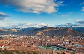 Aerial view of Cusco Main Square, Peru, with a background of the Peruvian Andes