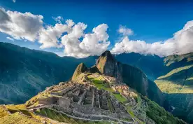 An aerial view of Historic Sanctuary of Machu Picchu and the surrounding peaks