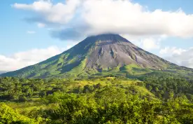 View of Arenal Volcano surrounded by rainforest in Costa Rica