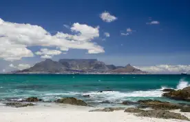 View of table mountain from a beach shore in South Africa