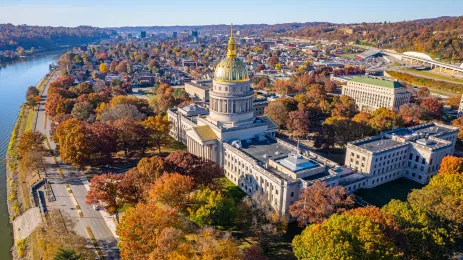 Aerial view of the West Virginia State Capitol Building and downtown Charleston with fall foliage