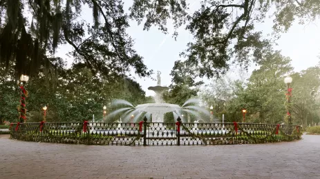 fountain at Forsyth Park decorated for Christmas with ribbons