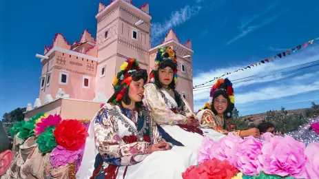 Girls in traditional costume on a float in Moroccan festival