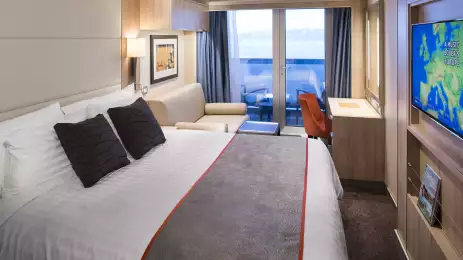 Double bed suite inside a Holland America cruise ship