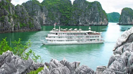 View of ferry on the Au Co Cruise in Halong Bay with rocky clifftops