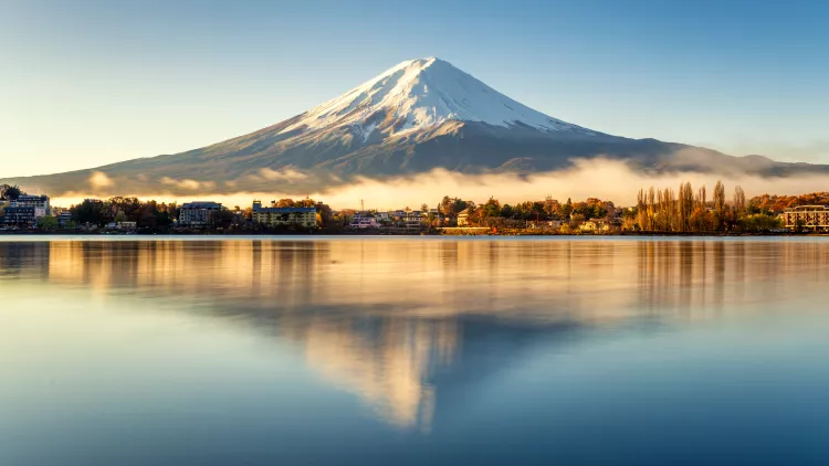 Mount Fuji and its reflection in lake on a bright day in Japan