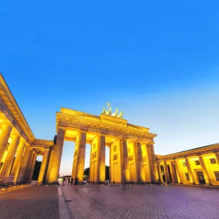Brandenburg Gate illuminated at night in Berlin, Germany.