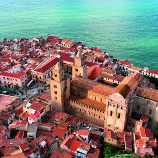 Aerial view of beautiful Mediterranean town, showcasing the Cathedral of Cefalù in Sicily, Italy