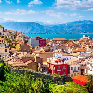 Peloponnese old town houses and snow mountains view