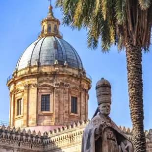 Exterior of the Palermo Cathedral with statue in Sicily, Italy