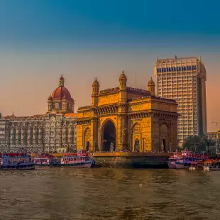 Gateway of India and the Mumbai harbour with ferries in Bombay, India