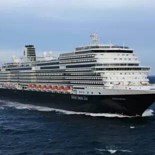 Side view of a cruise ship in transit along the ocean