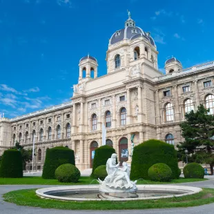 Fountain with sculptures and the Natural History Museum in Vienna, Austria