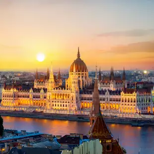 Parliament on riverbank of Danube at sunrise in Budapest, Hungary