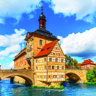 City Hall building with two bridges over the Regnitz river in Bamberg town, Germany