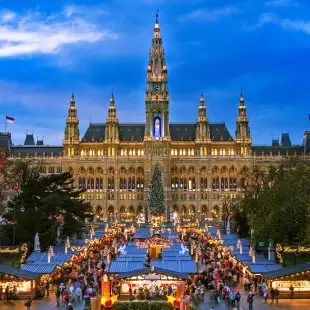 Traditional Christmas market at Vienna Town Hall at night in front of town hall