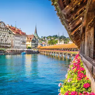 Famous Chapel Bridge in the historic city center of Lucerne, the city's symbol and one of Switzerland's main tourist attractions and views on a sunny day in summer, Canton of Lucerne, Switzerland