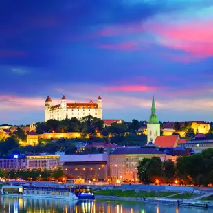 View of Bratislava Castle from the river under a colour evening sky