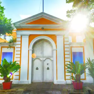 Colourful yellow and white house displaying French architecture. Pondicherry