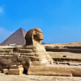 Great sphinx with the pyramid in the background, Giza, Egypt