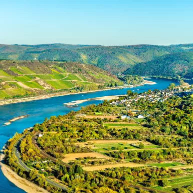 The great loop of the Rhine at Boppard in Germany, bright blue waters and hills in the distance.