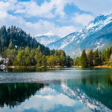 Fantastic views of the tranquil lake with amazing reflection. Mountains & glacier in the background. Peaceful & picturesque landscape. Location: Austria, Europe.