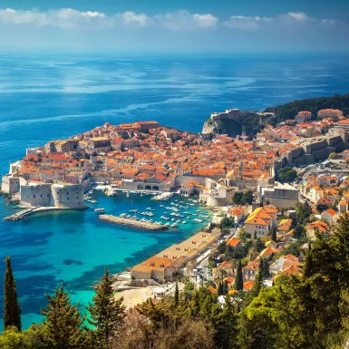 Aerial view of Dubrovnik city with old town houses and beautiful sea waters