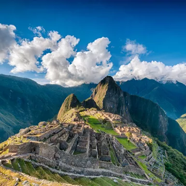 An aerial view of Historic Sanctuary of Machu Picchu and the surrounding peaks