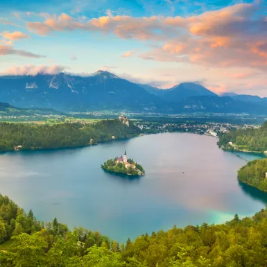 Julian Alps and Lake Bled with St. Marys Church on small island in Slovenia, Europe