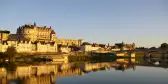 Amboise castle reflected in the water at dusk, France