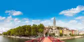 Pedestrian Saint Georges footbridge and the Saint Georges church in Lyon, France