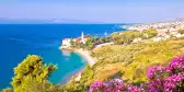 Monastery on pebble beach and sea on the island of Brac in Croatia