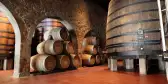 Old fashioned Porto wine cellar with wooden barrels in Porto, Portugal