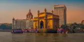 Gateway of India and the Mumbai harbour with ferries in Bombay, India