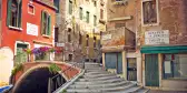 Side street of Venice with a bridge and old buildings