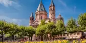 Ancient cathedral in Meinz, Germany surrounded by spring flowers