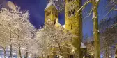 St. Michael church covered in snow at night in Cologne, Germany