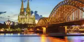 Cologne Cathedral and Hohenzollern bridge illuminated in Cologne, Germany