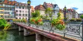 Pretty bridge across a waterways of Strasbourg, capital city of the Alsace region, France