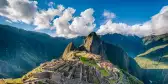 An aerial view of Historic Sanctuary of Machu Picchu and the surrounding peaks