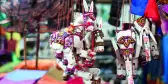 Sale of souvenirs in the market, Siem Reap, Cambodia. Funny handmade wooden puppets donkeys and elephants with bright colorful harness.