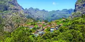 Village nestles between the copse covered mountains, Curral das Freiras