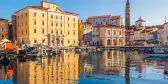 Majestic reflections of waterfront buildings of Piran