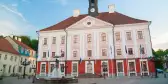 Front view of Tartu City Town Hall and fountain, located in Town Hall Square