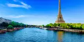 View of the Eiffel Tower and river Seine on a sunny day in Paris, France