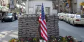 US Army Checkpoint with soldier holding the US flag in Berlin, Germany