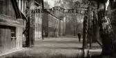 Black and white image of Auschwitz concentration camp gate, Poland